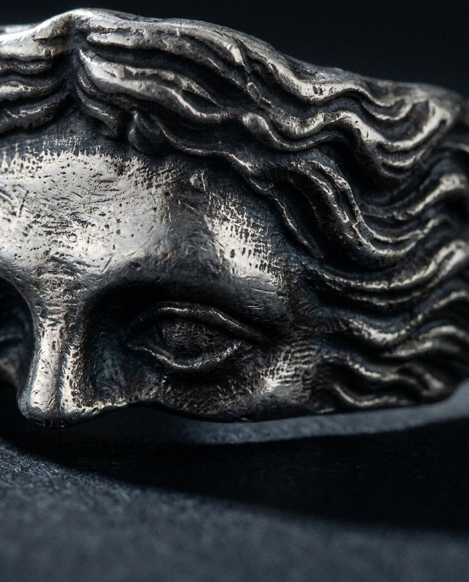 Marble ring, sculpted face up close
