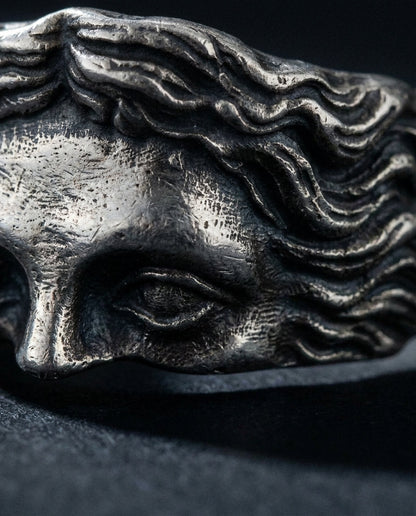 Marble ring, sculpted face up close